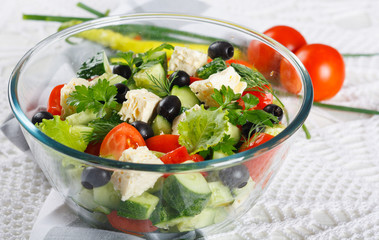Salad of fresh vegetables and cheese on  served table