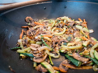 Cooking vegetables in wok