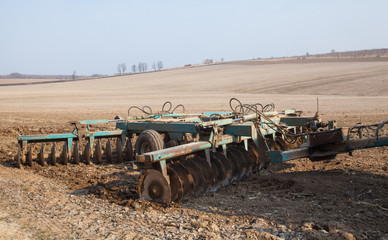Harrowing the soil with disc harrows