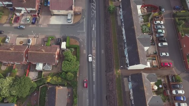 Wide Aerial shot following cars driving through Exeter in Devon