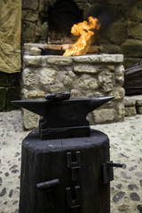 Fototapeta premium Incandescent iron in an old metal forge