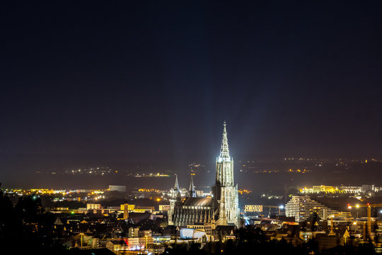 The Ulm cathedral at full moon - a glowing city