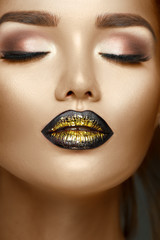 Beauty fashion model girl with black and gold gradient lips, Trendy makeup, perfect skin, glamour eyeshadows