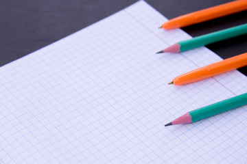 school supplies on chalkboard background