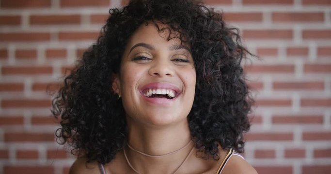 close up portrait beautiful young hispanic woman laughing cheerful enjoying success happy independent female student 