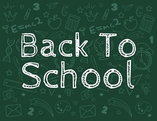 Back to school text drawing by colorful chalk in blackboard with school items and elements
