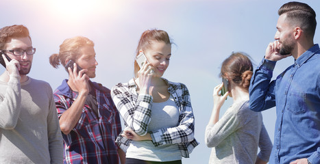 young people talking on their smartphones.