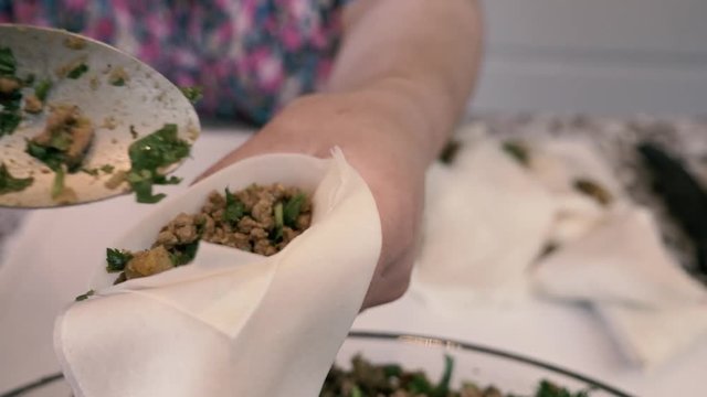 Filling Samosas with mince meat