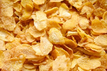 Golden cornflakes breakfast texture background