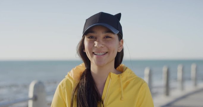 Portrait Of Awkward Teenage Girl Smiling Cheerful Looking At Camera Wearing Braces Enjoying Sunny Seaside Beach