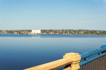 view of the city's waterfront on the river from the bridge.