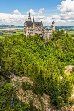 Hohenschwangau, Germany - June 10, 2018: The idyllic Neuschwanstein Castle positioned high up on a mountain in the Bavarian Alps. Commissioned by King Ludwig II of Bavaria.