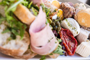 Healthy fresh dish with typical Maltese food with ham and raw spring or summer mediterranean vegetables