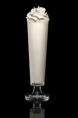 Coconut milk cocktail with whipped cream and coconut chips isolated on black with clipping path