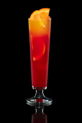 Tequila sunrise cocktail and orange isolated on black with clipping path