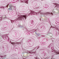 Satin ribbon pink roses pattern background
