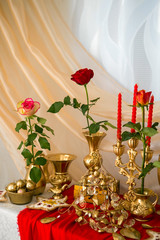 Golden background, roses in a vase, various gilt objects of everyday life