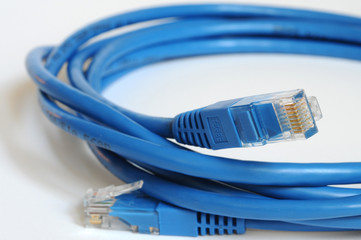 closeup on blue Ethernet Cable isolated on white