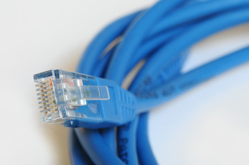 closeup on blue Ethernet Cable isolated on white