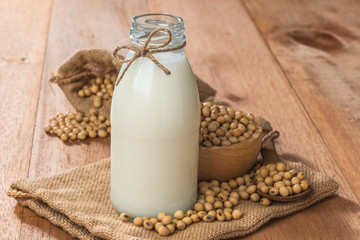 a bottle of soy milk natural nutrition drink on sackcloth