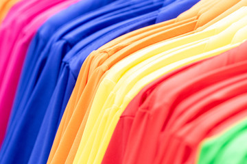 Colorful clothes hanging on a hanger, top