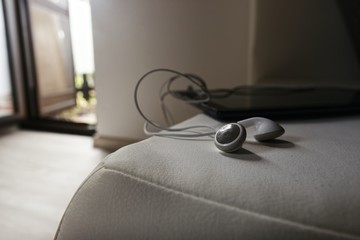Close Up of Headphones and Tablet in Interior 
