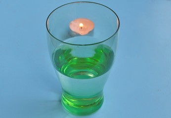 Glass of water and candle