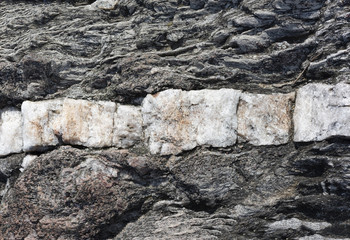 Milky Quartz Band in Dark Beach Rock in Maine