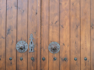 old wooden house door and metal handles