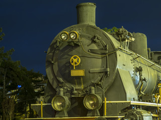 the old locomotive standing on the rails