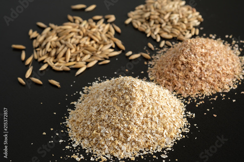 Bran Oatmeal With A Large Grind Grains Of Oats And Wheat On Black Bran Oatmeal With A Large Grind Grains Of Oats And Wheat On Black
