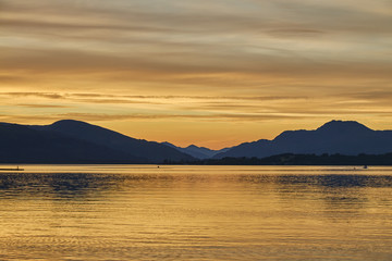 Colorful scenic sunset view of Loch lomond lake in Scotland, United Kingdom.