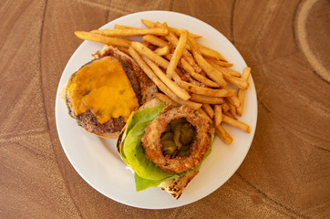 Cheeseburger Plate With French Fries And Onion Ring