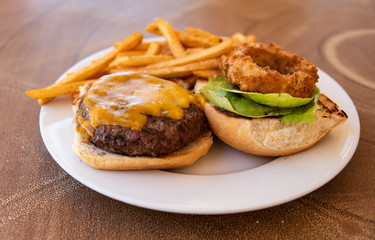 Cheeseburger Plate With French Fries And Onion Ring