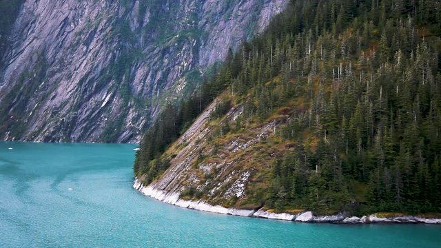 The stunning scenery of Tracy Arm Fjord near Juneau, Alaska. Untamed, natural wilderness and wildlife with incredible landscape. Slow motion.