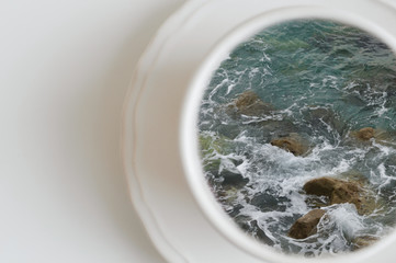 Cup of ocean, cup of sea. Creative concept