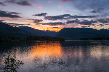 Spring Sunset over the Mountains and the Columbia River in Revelstoke, BC, Canada.