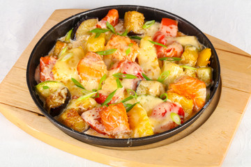 Baked salmon with potato in pan