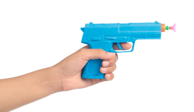 hand holding Toy Gun made of plastic isolated on white background