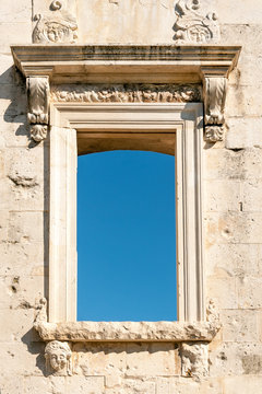 Cut out window with blue sky in the old wall, Zagreb, Croatia