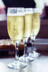 Glasses with beverage on the table with food
