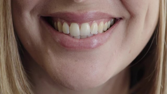 close up woman mouth smiling happy showing healthy white teeth dental health concept