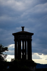 Silhouette of Calton hill monument with a moody sky in the background