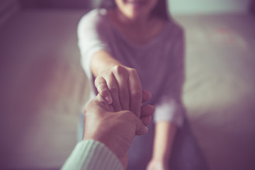 Psychiatrist holding hands depressed woman patient,Mental health care concept