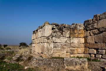 Fototapeta na wymiar Ruins of an ancient city against the blue sky