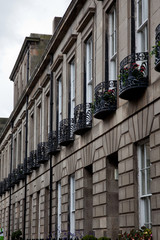 Facade of Edinburgh Town Houses showing ornate balustrades.