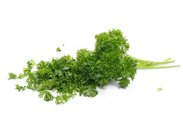 Papier Peint photo Herbes Fresh green chopped parsley leaves isolated on white background 