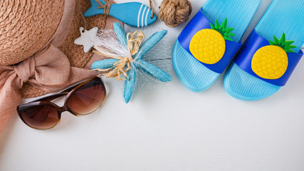 Summer beach accessories on white background, top view