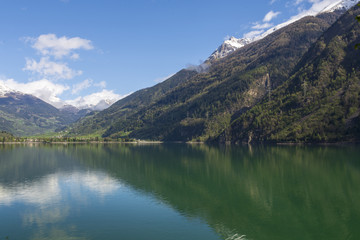Fototapeta na wymiar View ower lake Lago di poschiavo with calm turquoise water