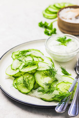 Summer healthy cucumber and fennel salad with yogurt dressing. Selective focus, space for text.